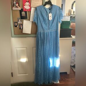 Long, baby blue dress.